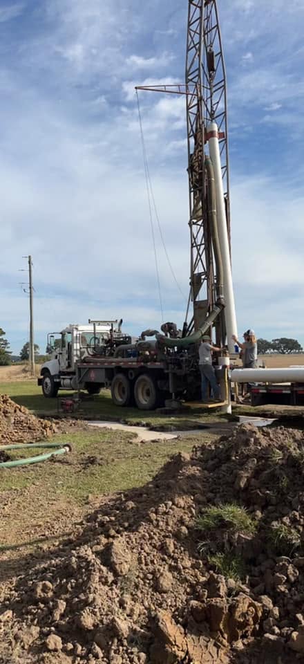 R.A.M. Drilling crew setting casing at a job site